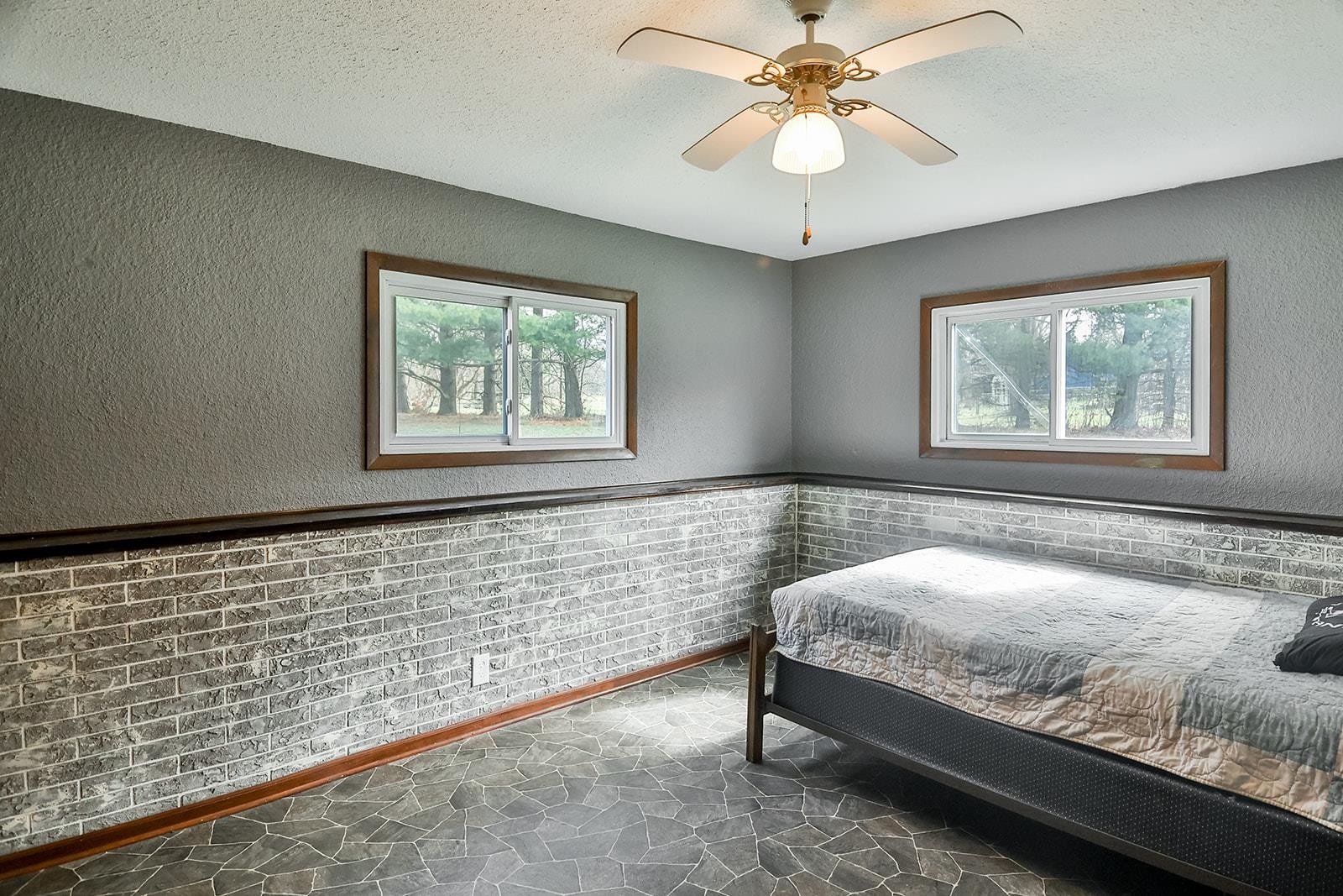 6855 Happy Acres Road Rockford, IL 61101 - Photo 14 of 39 a bedroom with a bed and a chandelier