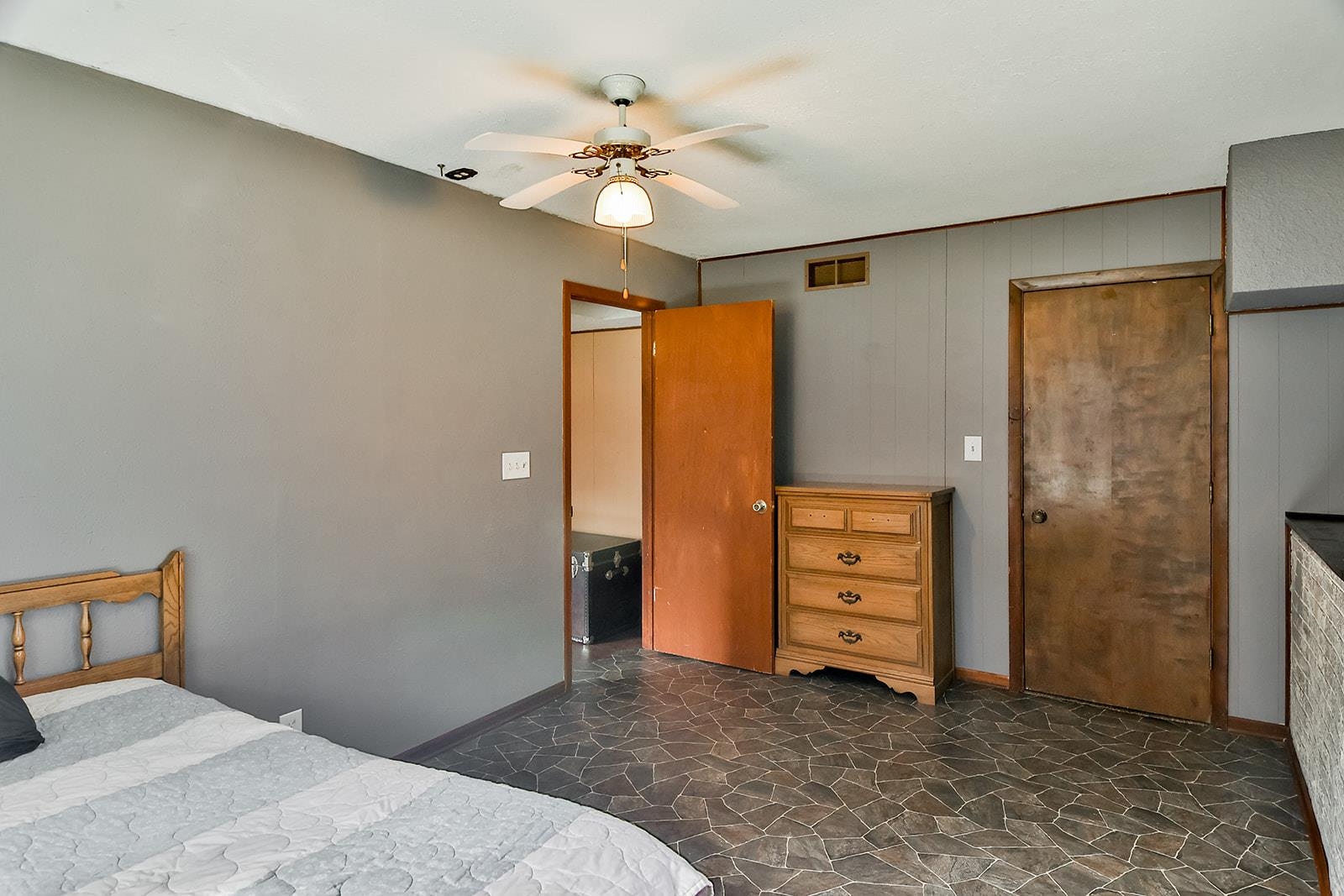 6855 Happy Acres Road Rockford, IL 61101 - Photo 15 of 39 a bedroom with a bed and a ceiling fan
