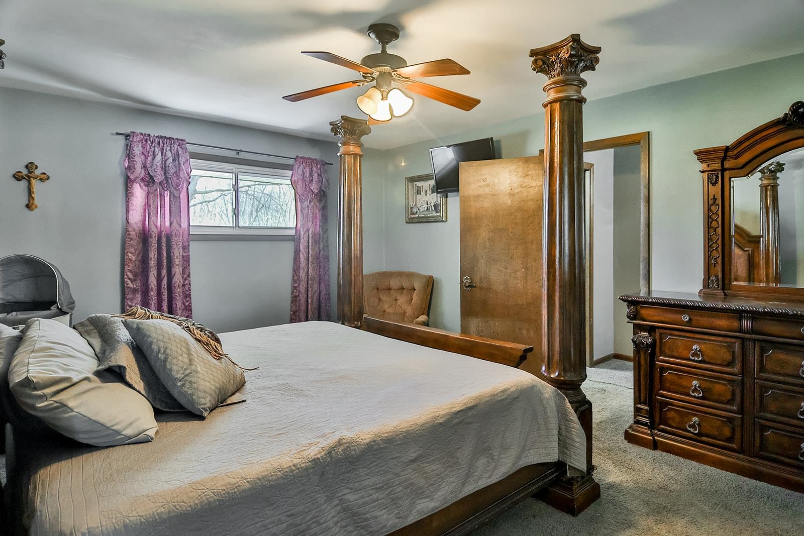 6855 Happy Acres Road Rockford, IL 61101 - Photo 16 of 39 a bedroom with a bed and a chandelier