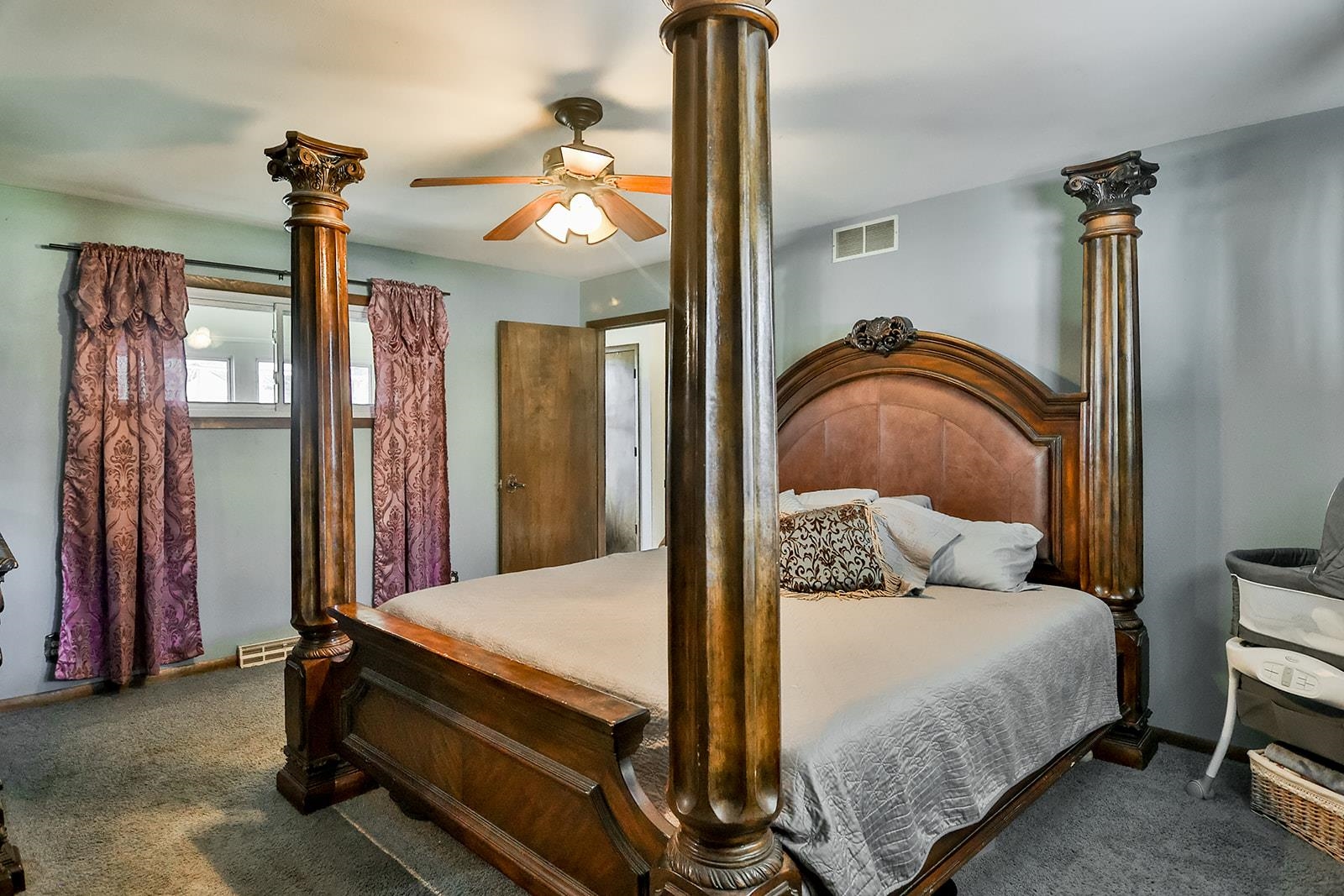 6855 Happy Acres Road Rockford, IL 61101 - Photo 17 of 39 a bedroom with a bed and a chandelier