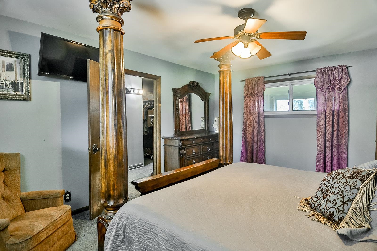 6855 Happy Acres Road Rockford, IL 61101 - Photo 18 of 39 a bedroom with a bed and a television