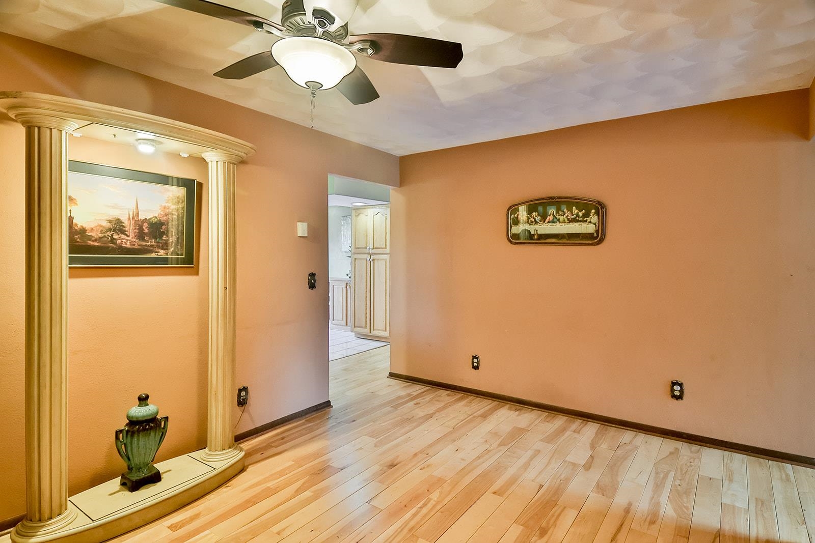 6855 Happy Acres Road Rockford, IL 61101 - Photo 22 of 39 a view of a room with wooden floor and a ceiling fan