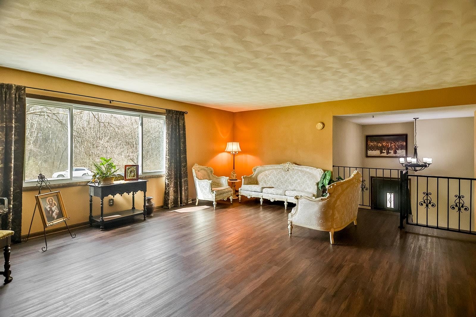6855 Happy Acres Road Rockford, IL 61101 - Photo 24 of 39 a living room with furniture and a wooden floor