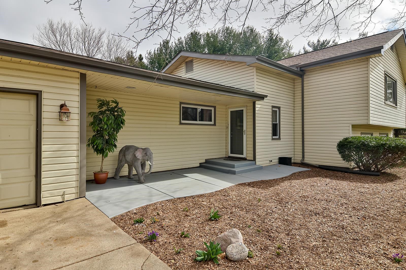 6855 Happy Acres Road Rockford, IL 61101 - Photo 3 of 39 a view of a house with a yard and garage