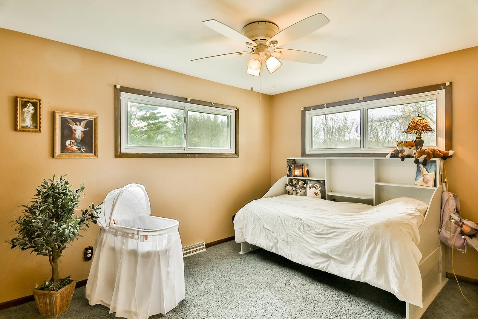 6855 Happy Acres Road Rockford, IL 61101 - Photo 31 of 39 a bedroom with a bed and a chandelier