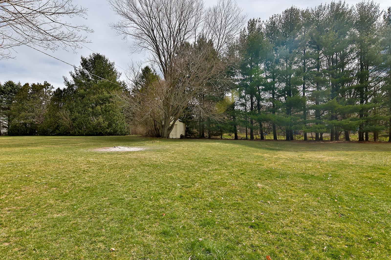 6855 Happy Acres Road Rockford, IL 61101 - Photo 38 of 39 a view of a yard with a trees
