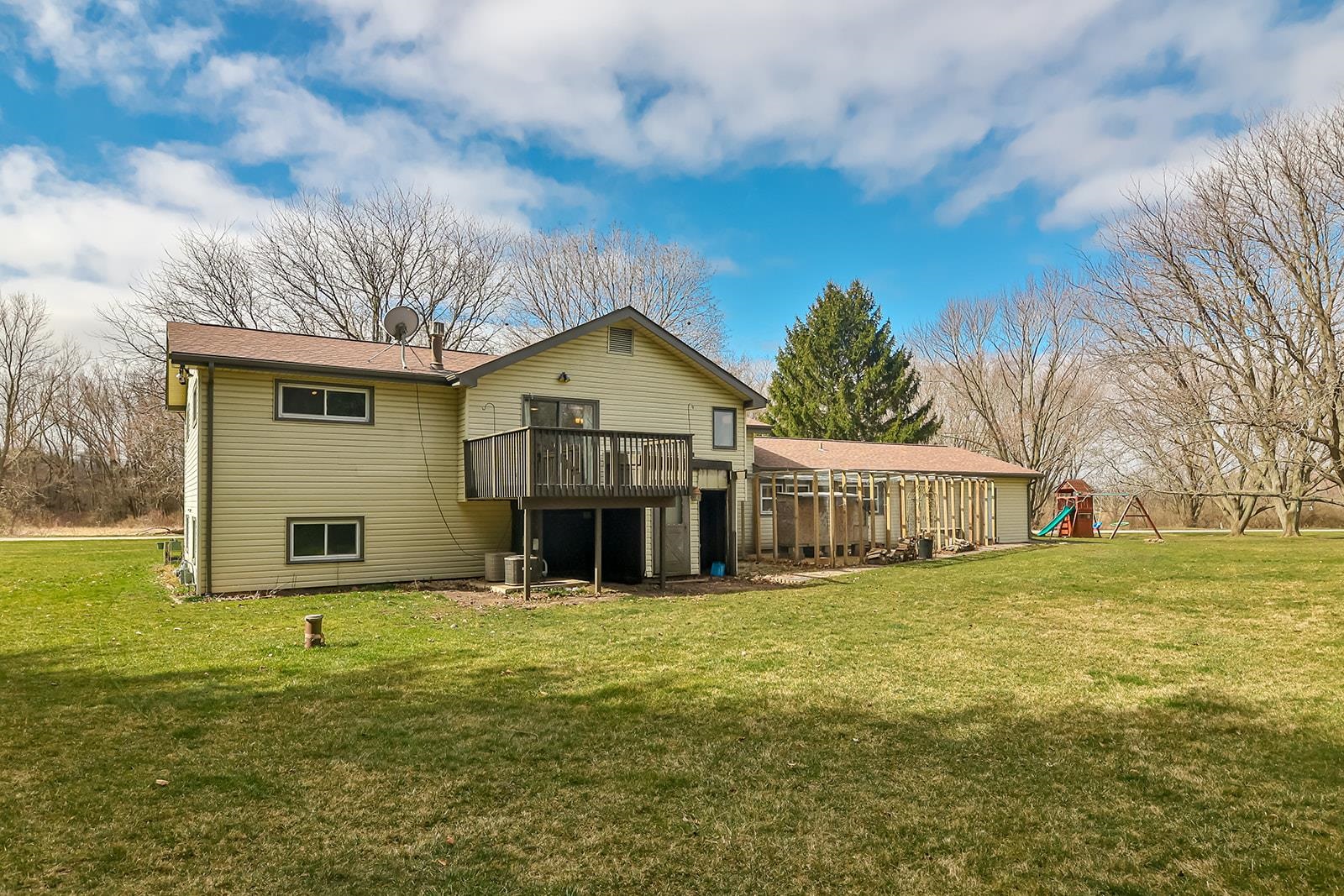 6855 Happy Acres Road Rockford, IL 61101 - Photo 4 of 39 a front view of house with yard outdoor seating and barbeque oven