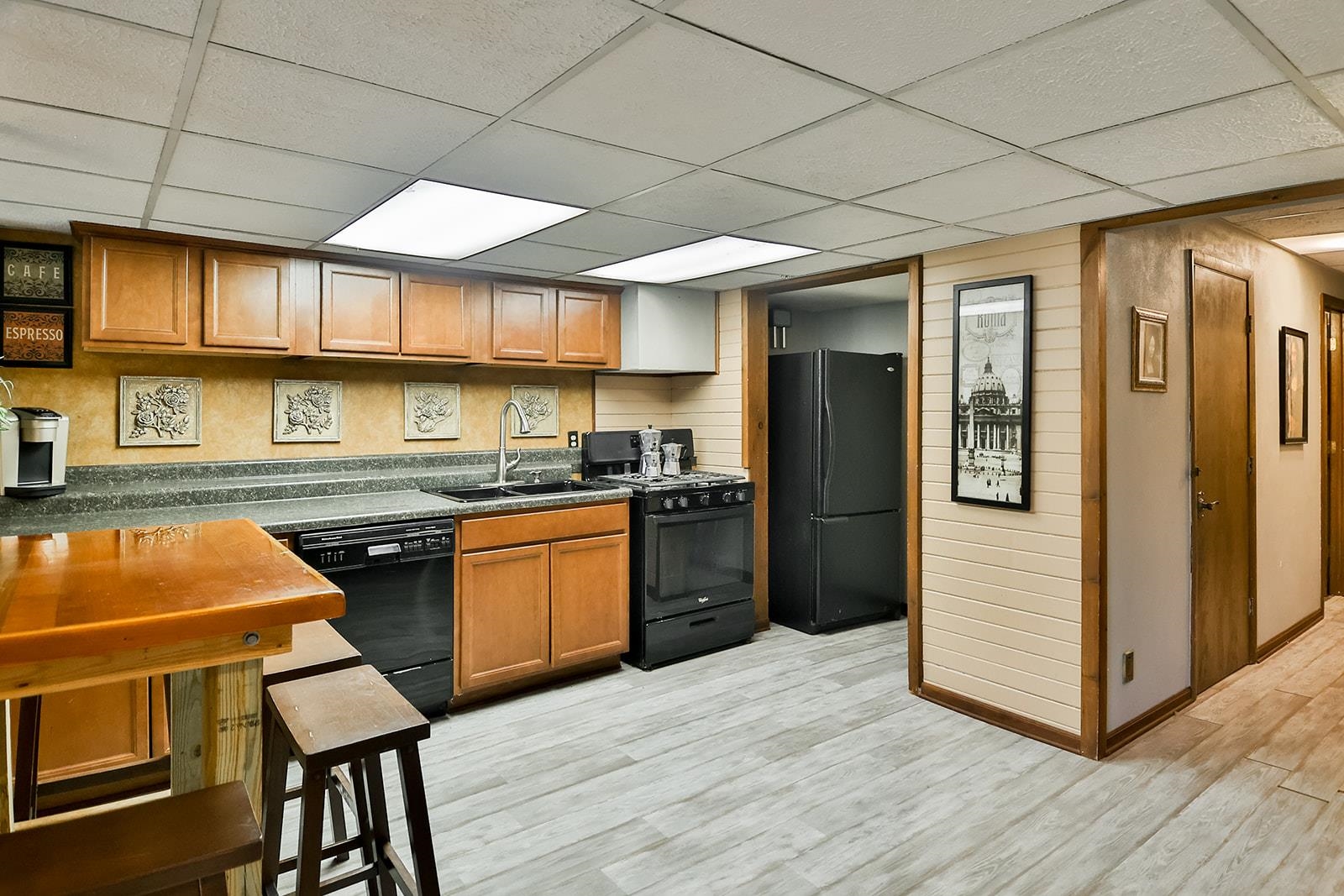 6855 Happy Acres Road Rockford, IL 61101 - Photo 10 of 39 a kitchen with stainless steel appliances granite countertop a refrigerator a sink dishwasher a stove and white countertops with wooden floor