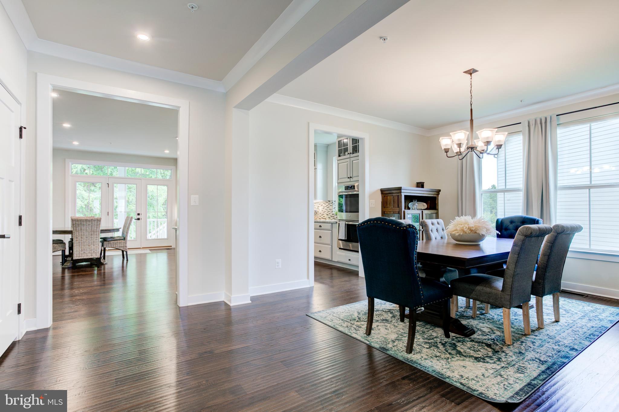 2346 Sweet Pepperbrush Loop Dumfries, VA 22026 - Photo 12 of 84 a view of a dining room with furniture window and wooden floor
