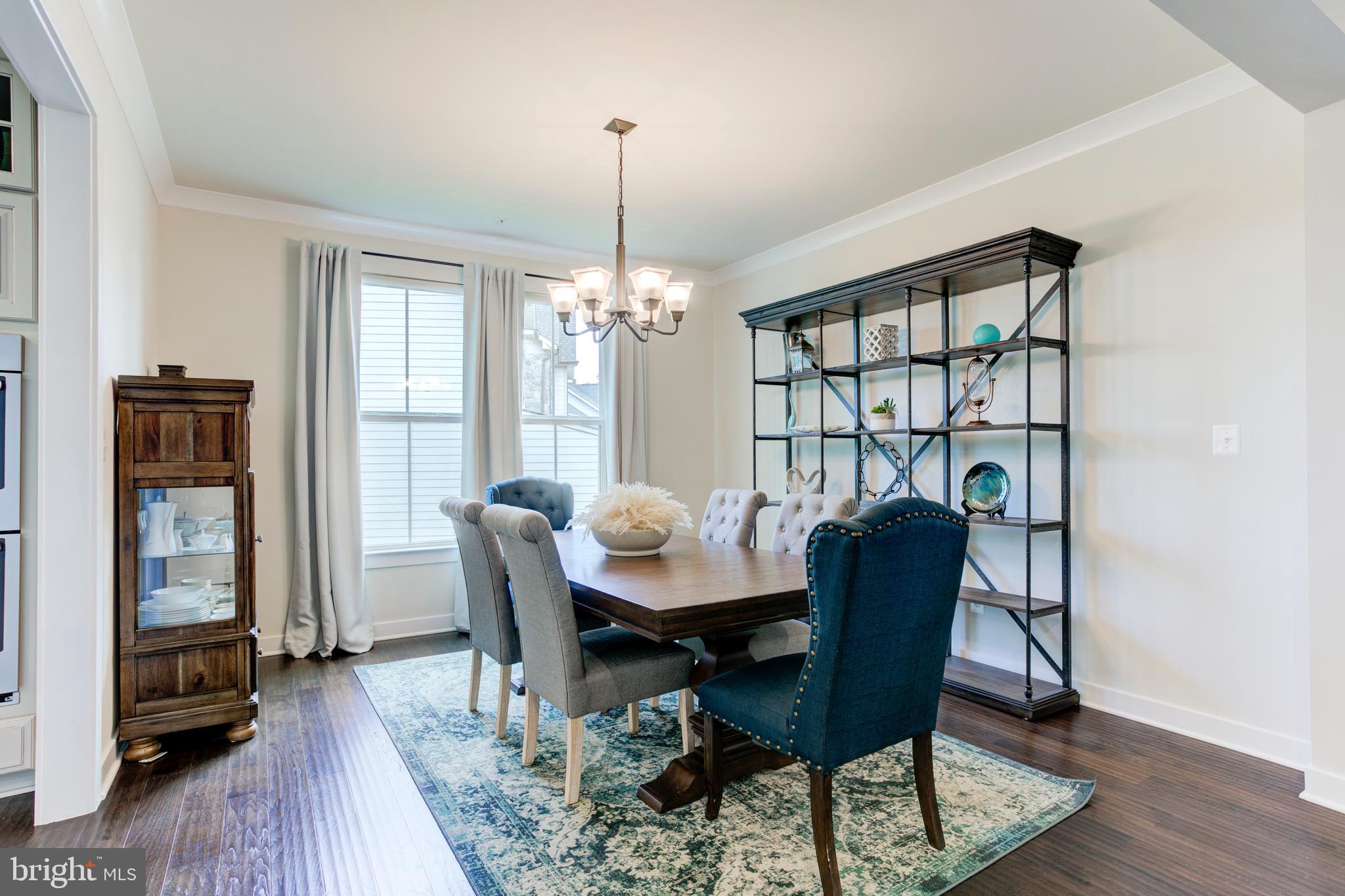 2346 Sweet Pepperbrush Loop Dumfries, VA 22026 - Photo 13 of 84 a view of a dining room with furniture window and wooden floor