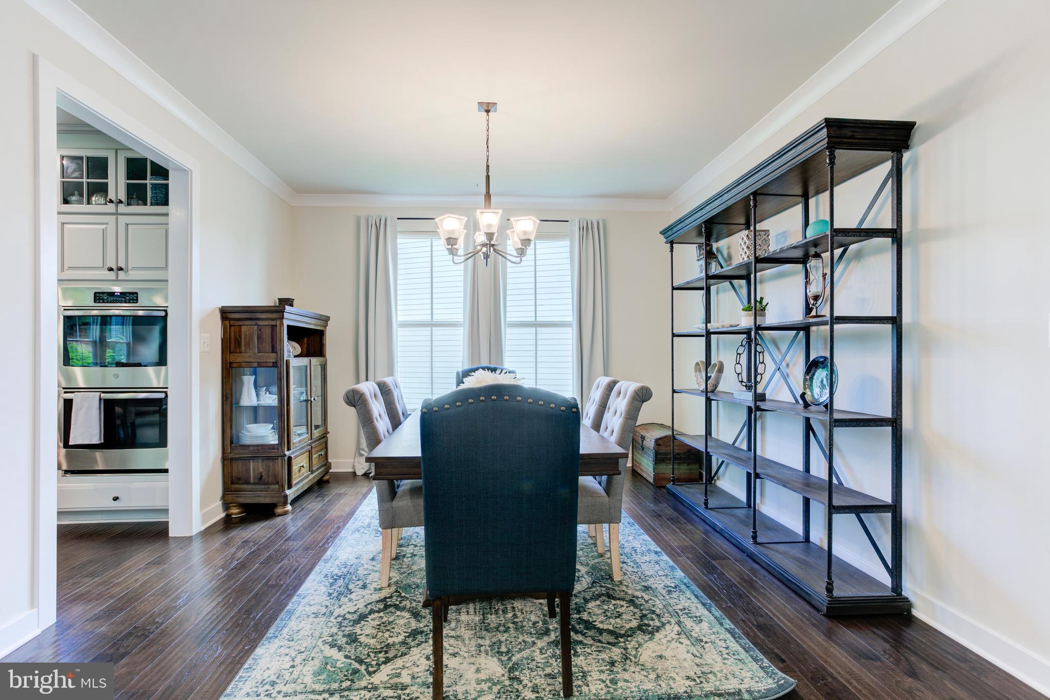 2346 Sweet Pepperbrush Loop Dumfries, VA 22026 - Photo 14 of 84 a living room with furniture and a chandelier