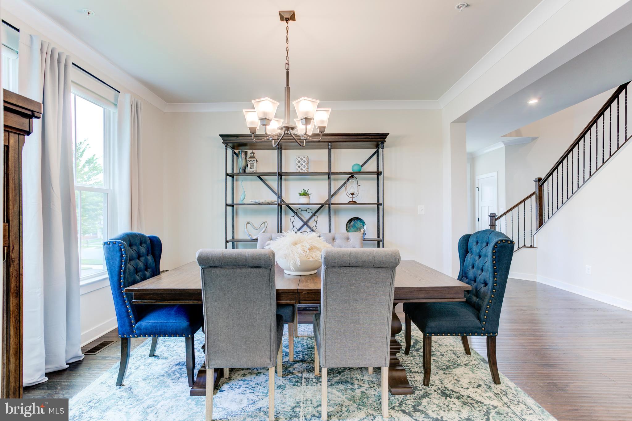 2346 Sweet Pepperbrush Loop Dumfries, VA 22026 - Photo 15 of 84 a view of a dining room with furniture window and wooden floor