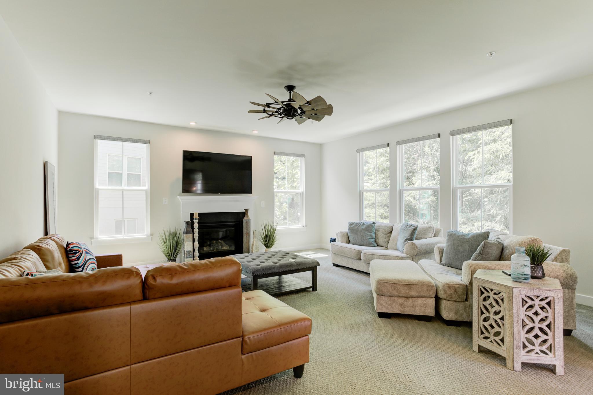 2346 Sweet Pepperbrush Loop Dumfries, VA 22026 - Photo 32 of 84 a living room with furniture and a fireplace
