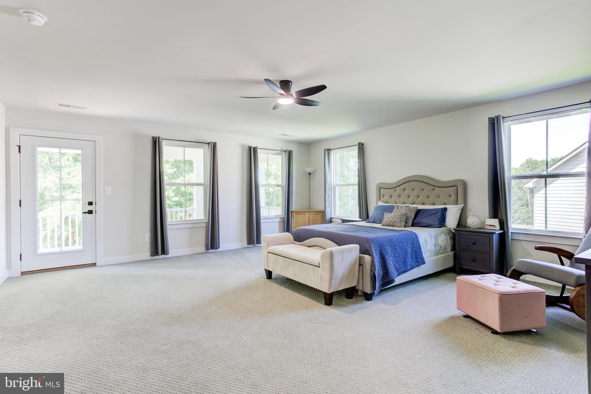 2346 Sweet Pepperbrush Loop Dumfries, VA 22026 - Photo 36 of 84 a spacious bedroom with a bed and window