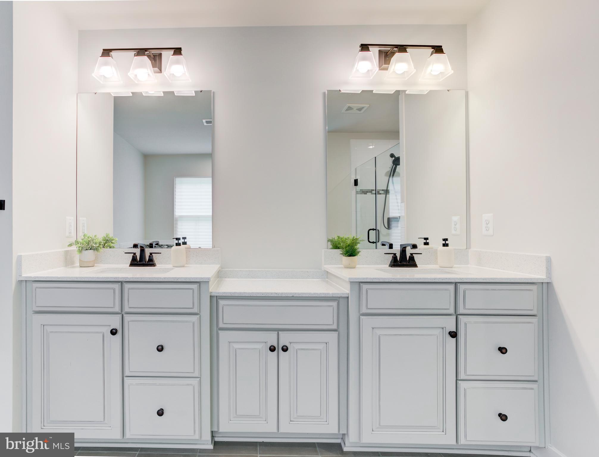 2346 Sweet Pepperbrush Loop Dumfries, VA 22026 - Photo 45 of 84 a bathroom with white cabinets and a sink