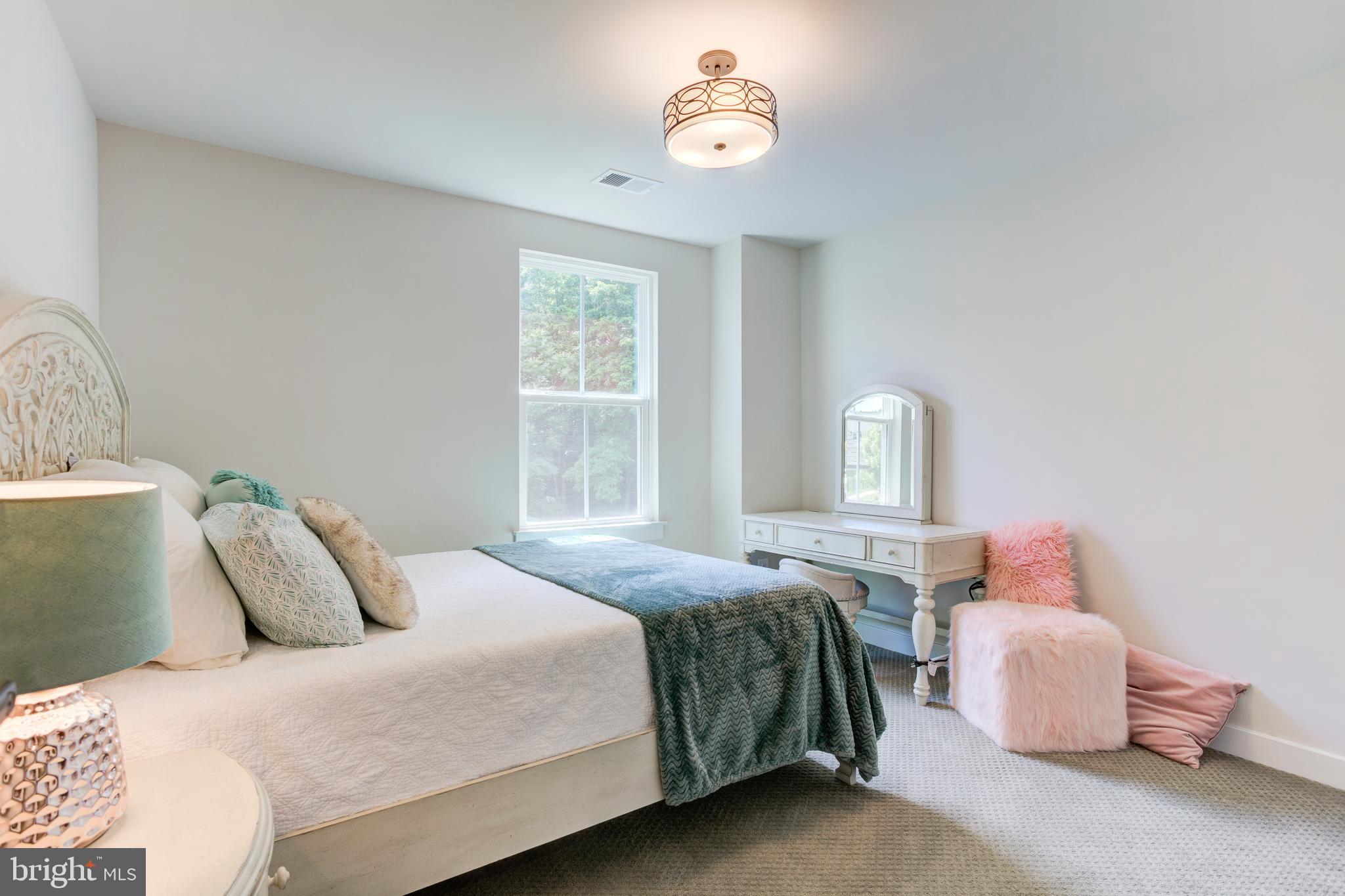 2346 Sweet Pepperbrush Loop Dumfries, VA 22026 - Photo 54 of 84 a bedroom with a bed and a window