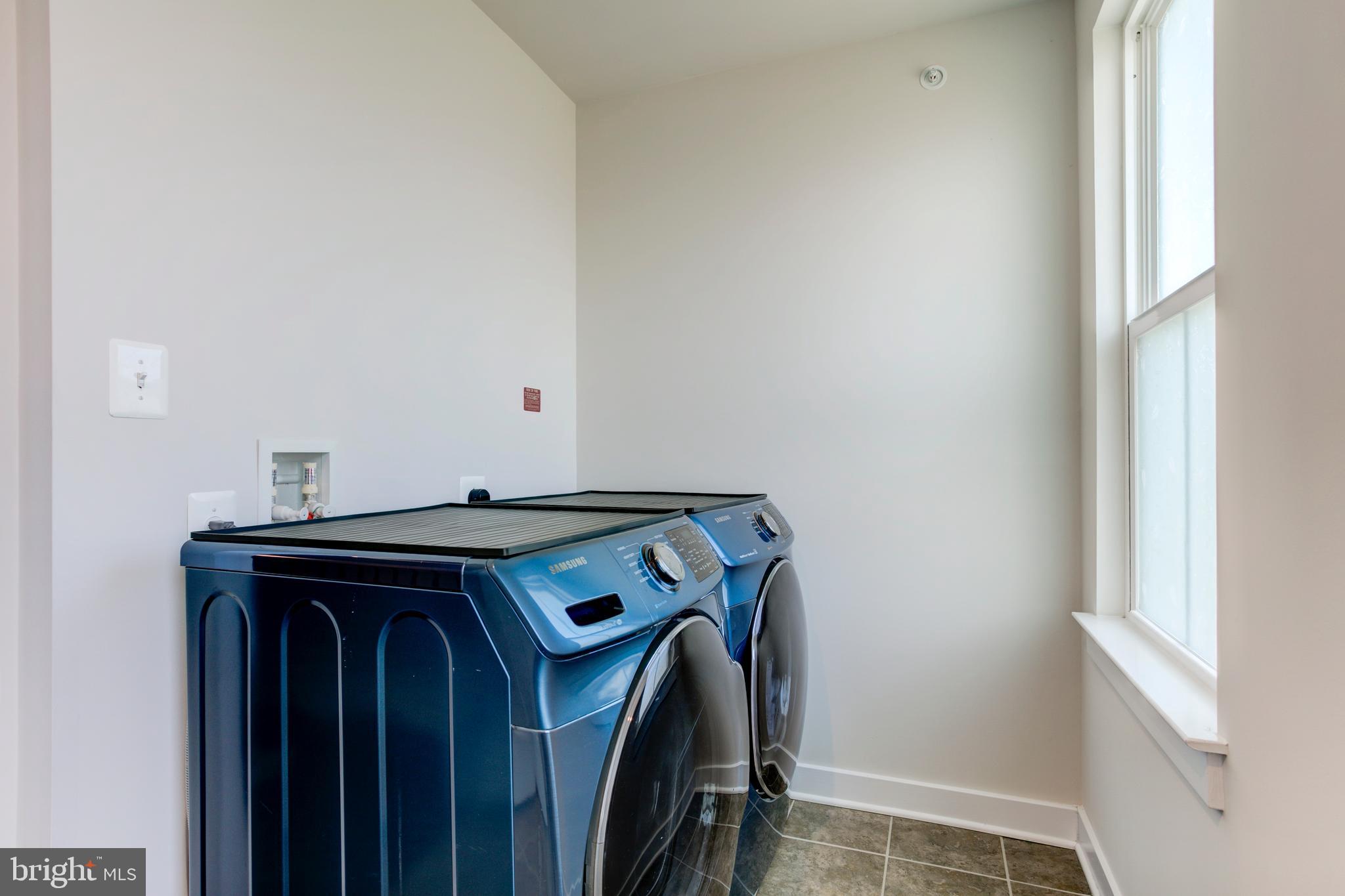 2346 Sweet Pepperbrush Loop Dumfries, VA 22026 - Photo 56 of 84 a utility room with dryer and washer