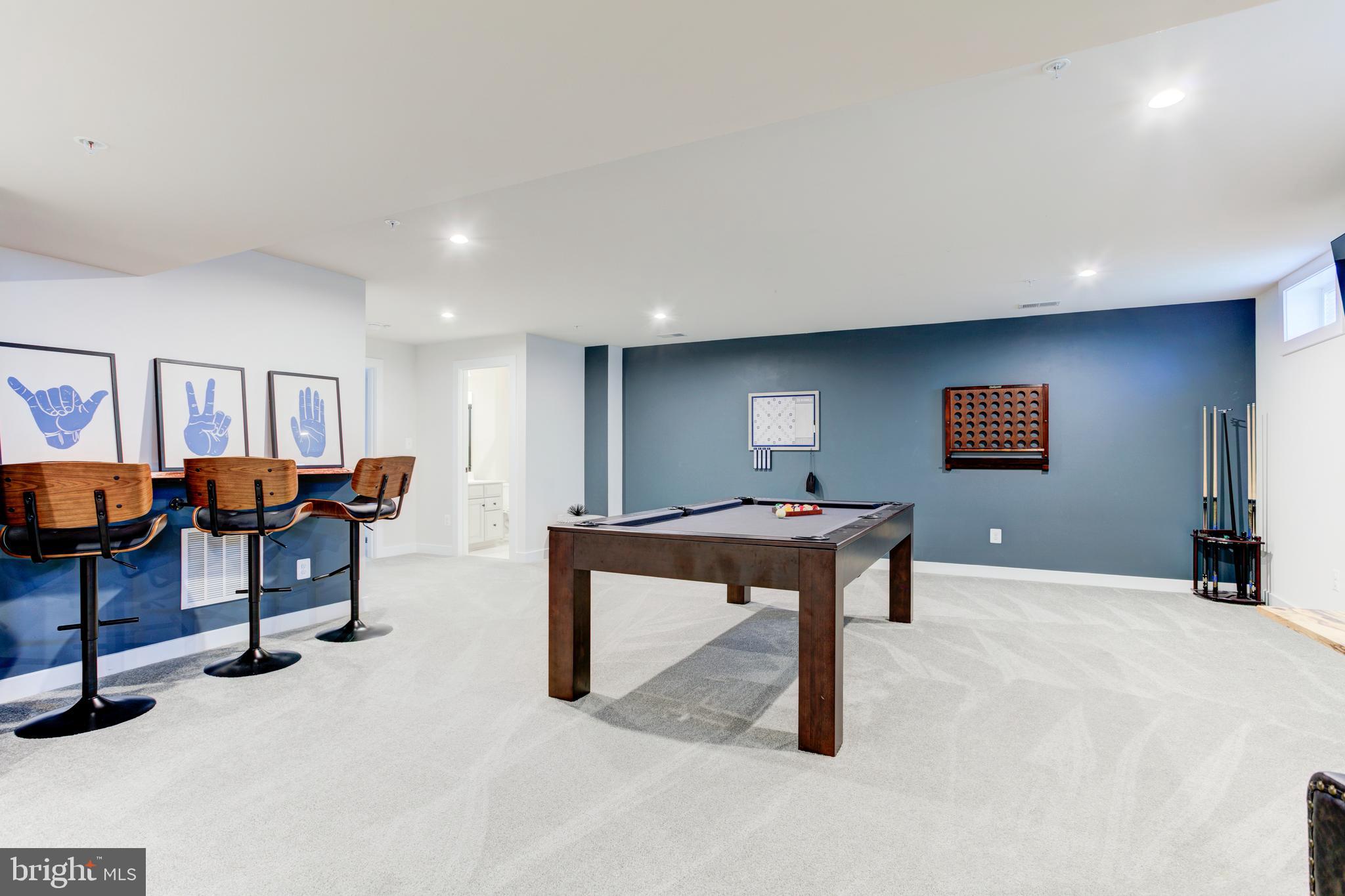 2346 Sweet Pepperbrush Loop Dumfries, VA 22026 - Photo 58 of 84 a room with furniture and air hockey table