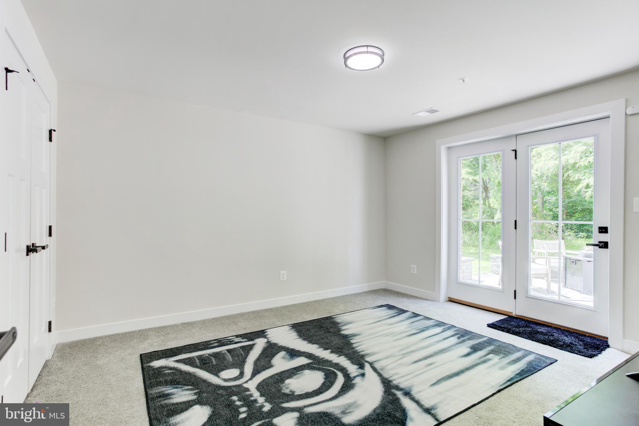 2346 Sweet Pepperbrush Loop Dumfries, VA 22026 - Photo 64 of 84 a view of a room that has a bed and a window in it