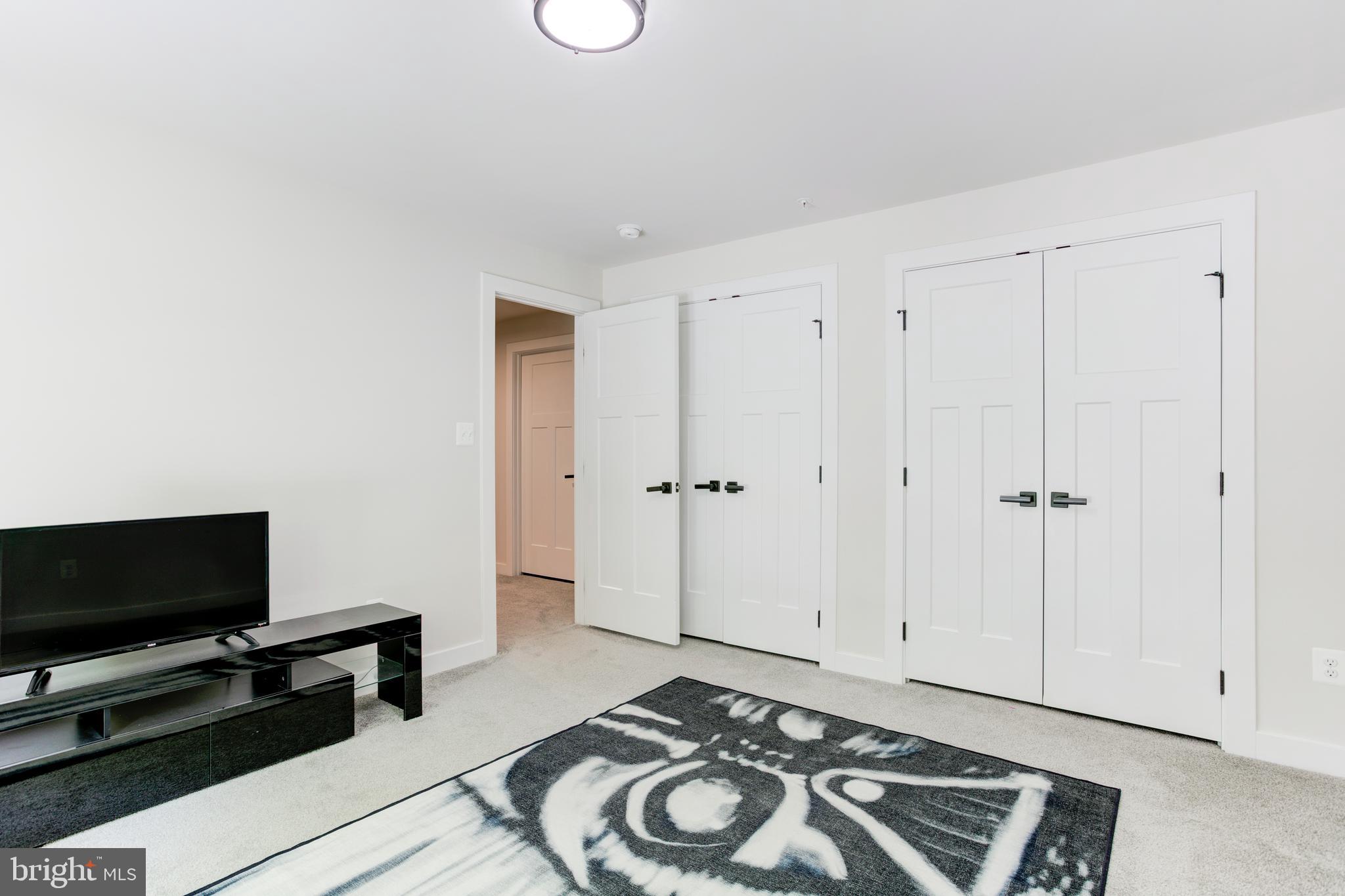 2346 Sweet Pepperbrush Loop Dumfries, VA 22026 - Photo 65 of 84 a view of a livingroom with furniture and a flat screen tv