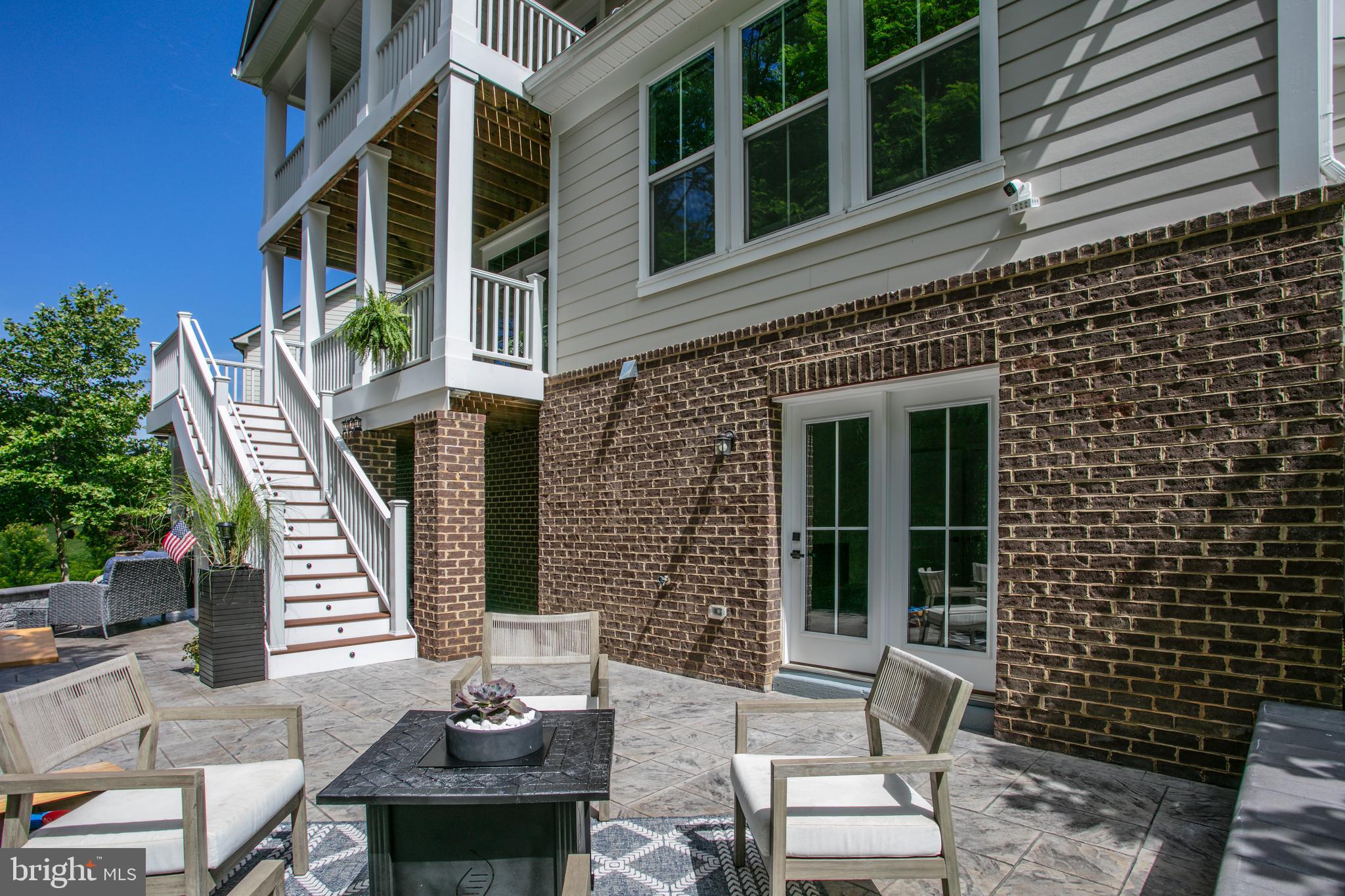 2346 Sweet Pepperbrush Loop Dumfries, VA 22026 - Photo 73 of 84 a view of a patio with couple of chairs and a potted plant