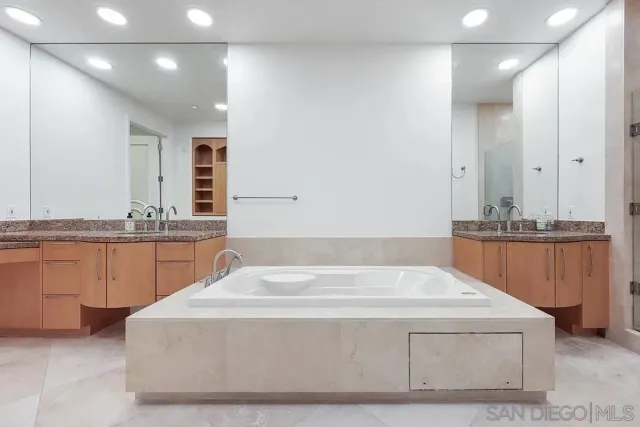 a bathroom with a bathtub and a sink