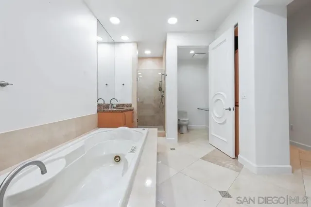 a bathroom with a bathtub and a sink