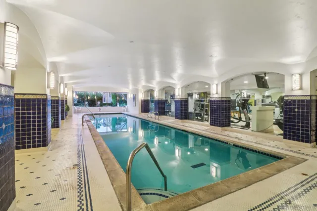 a view of a swimming pool with outdoor seating