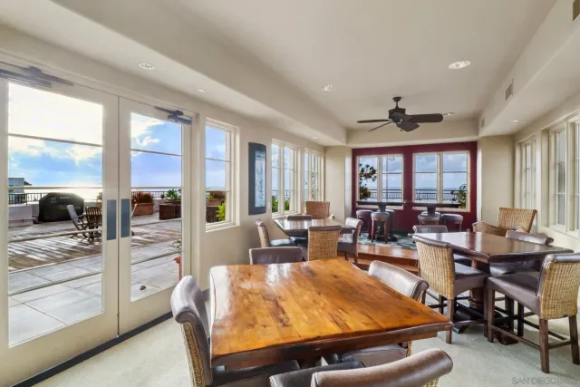 a living room with lots of furniture and a large window