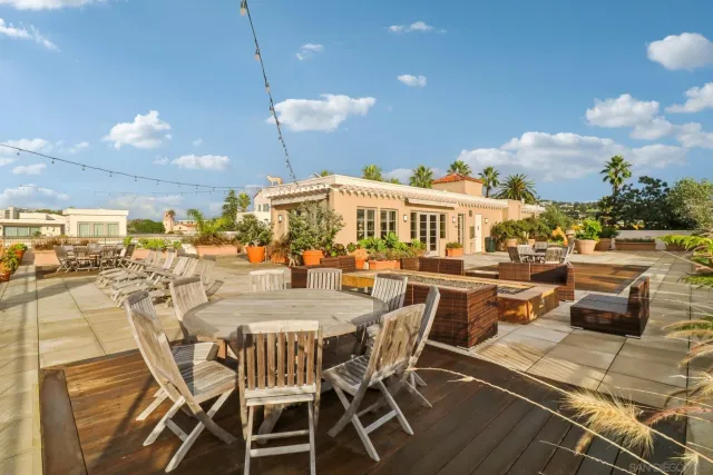 a view of a swimming pool with outdoor seating