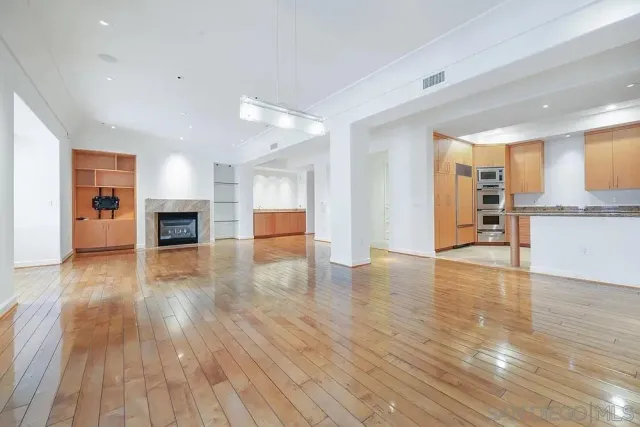 a view of a kitchen with a sink and a stove top oven