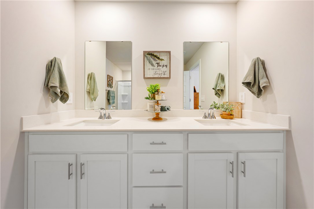 203 Maxwell Drive Easley, SC 29642 - Photo 25 of 34 This serene bathroom offers dual vanities with expansive counter space and ample storage.