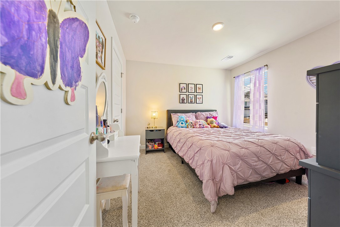 203 Maxwell Drive Easley, SC 29642 - Photo 27 of 34 This cozy bedroom features soft carpet and a bright window, perfect for comfortable living.