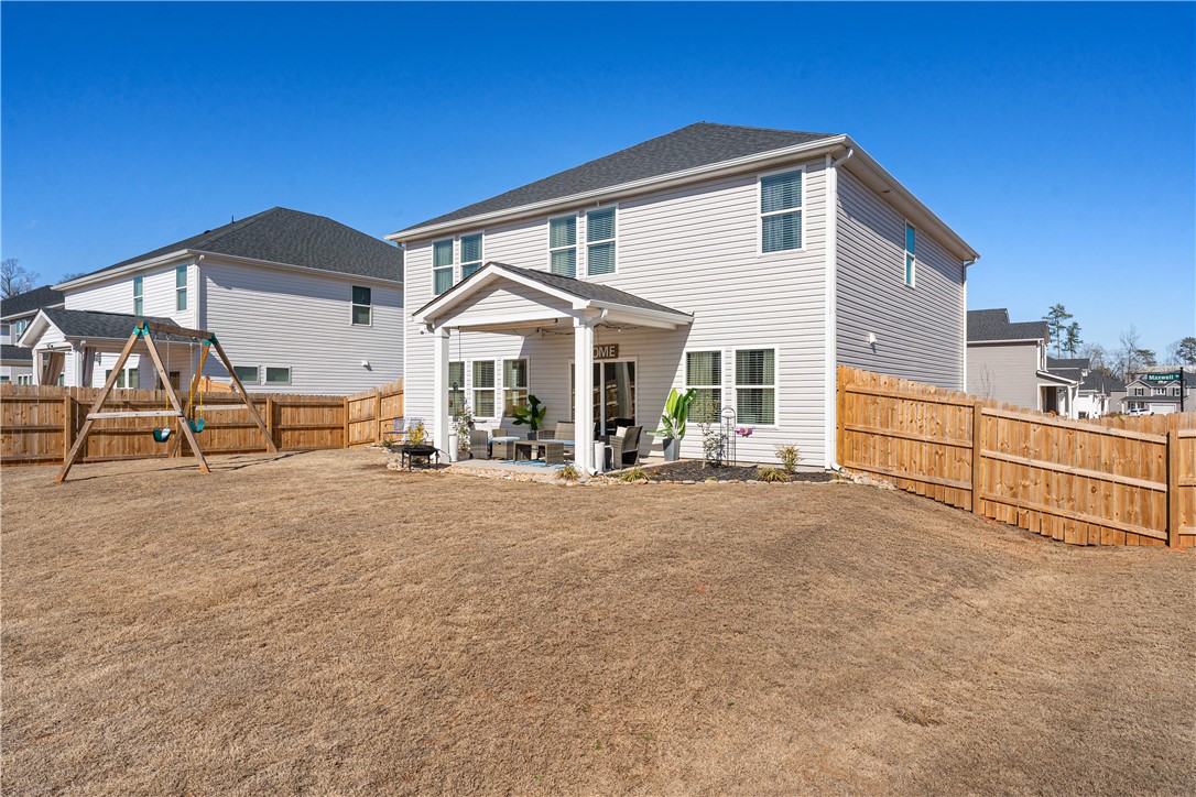 203 Maxwell Drive Easley, SC 29642 - Photo 33 of 34 This spacious yard features a covered patio perfect for outdoor living and entertaining.