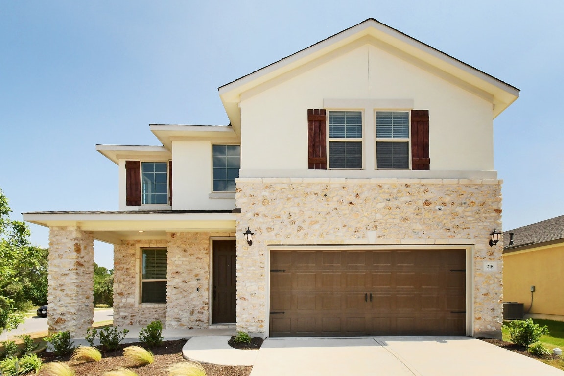 a front view of a house with glass windows