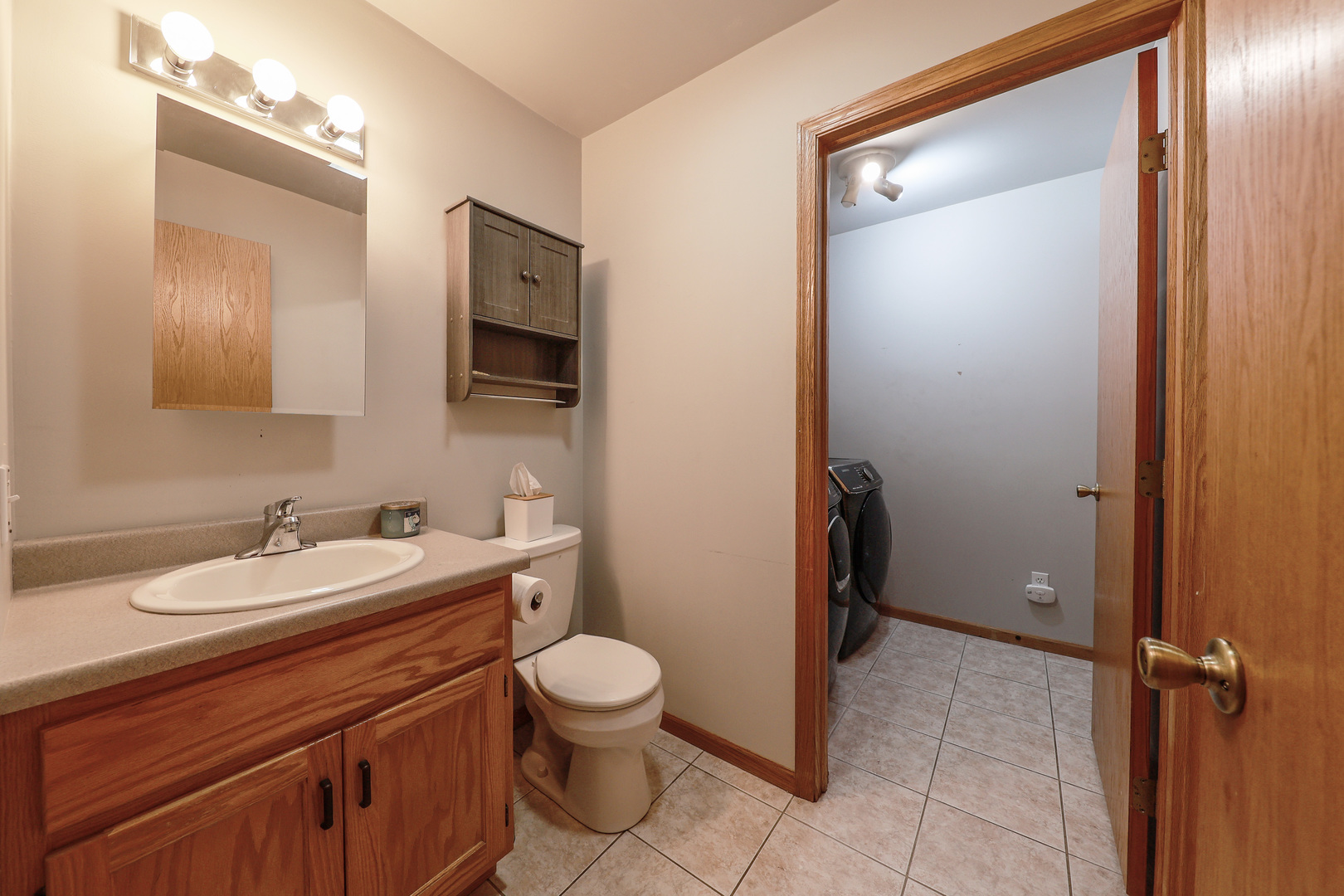 1115 Crystal Lane Diamond, IL 60416 - Photo 12 of 17 a bathroom with a toilet a sink and mirror