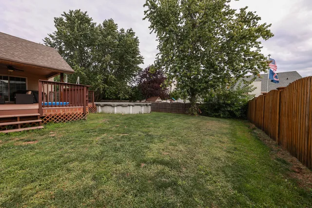 a backyard of a house with lots of green space