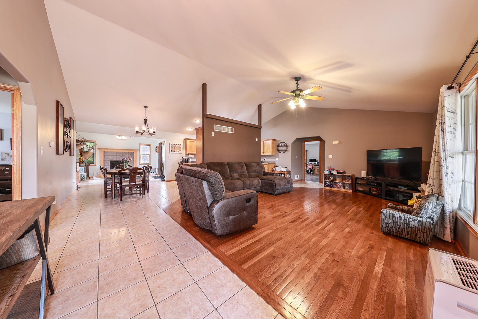 1115 Crystal Lane Diamond, IL 60416 - Photo 2 of 17 a living room with furniture and a flat screen tv