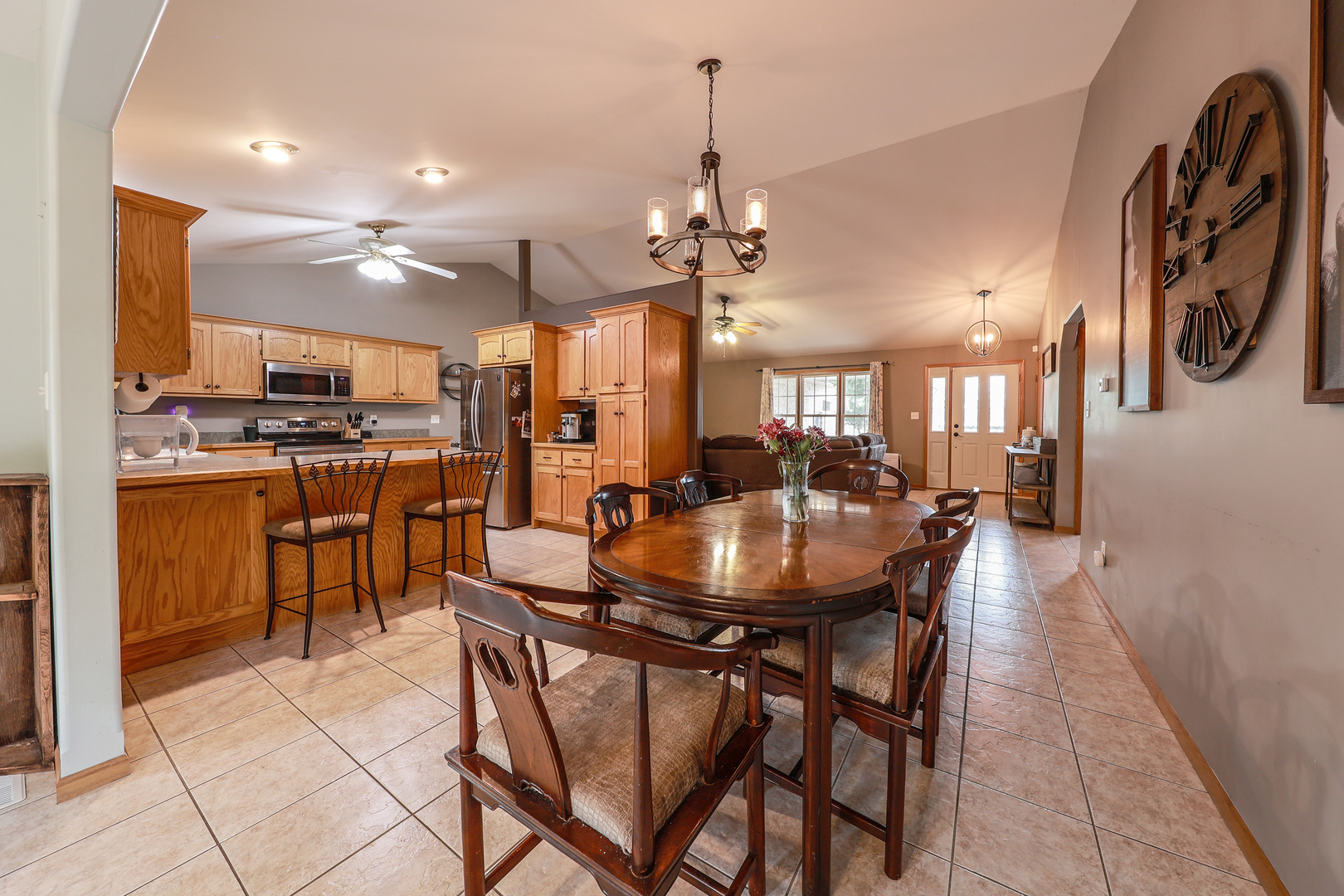 1115 Crystal Lane Diamond, IL 60416 - Photo 8 of 17 a view of a dining room with furniture and a chandelier