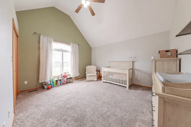 a bed room with a bed and a window