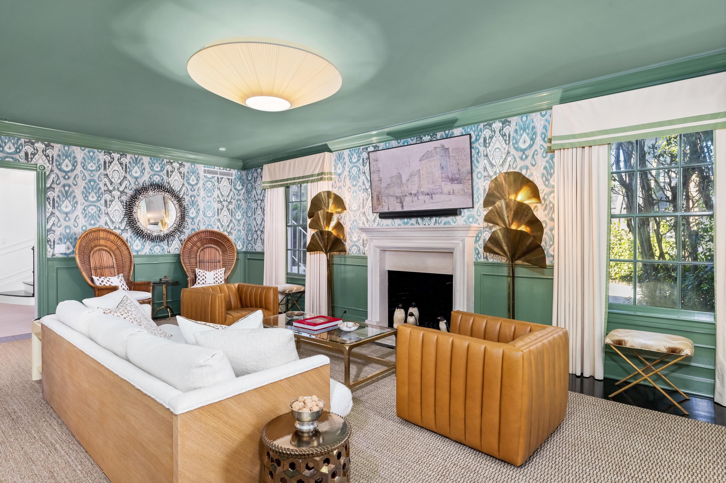 130 Cocoanut Row Palm Beach, FL 33480 - Photo 11 of 66 a living room with furniture a fireplace and a large window