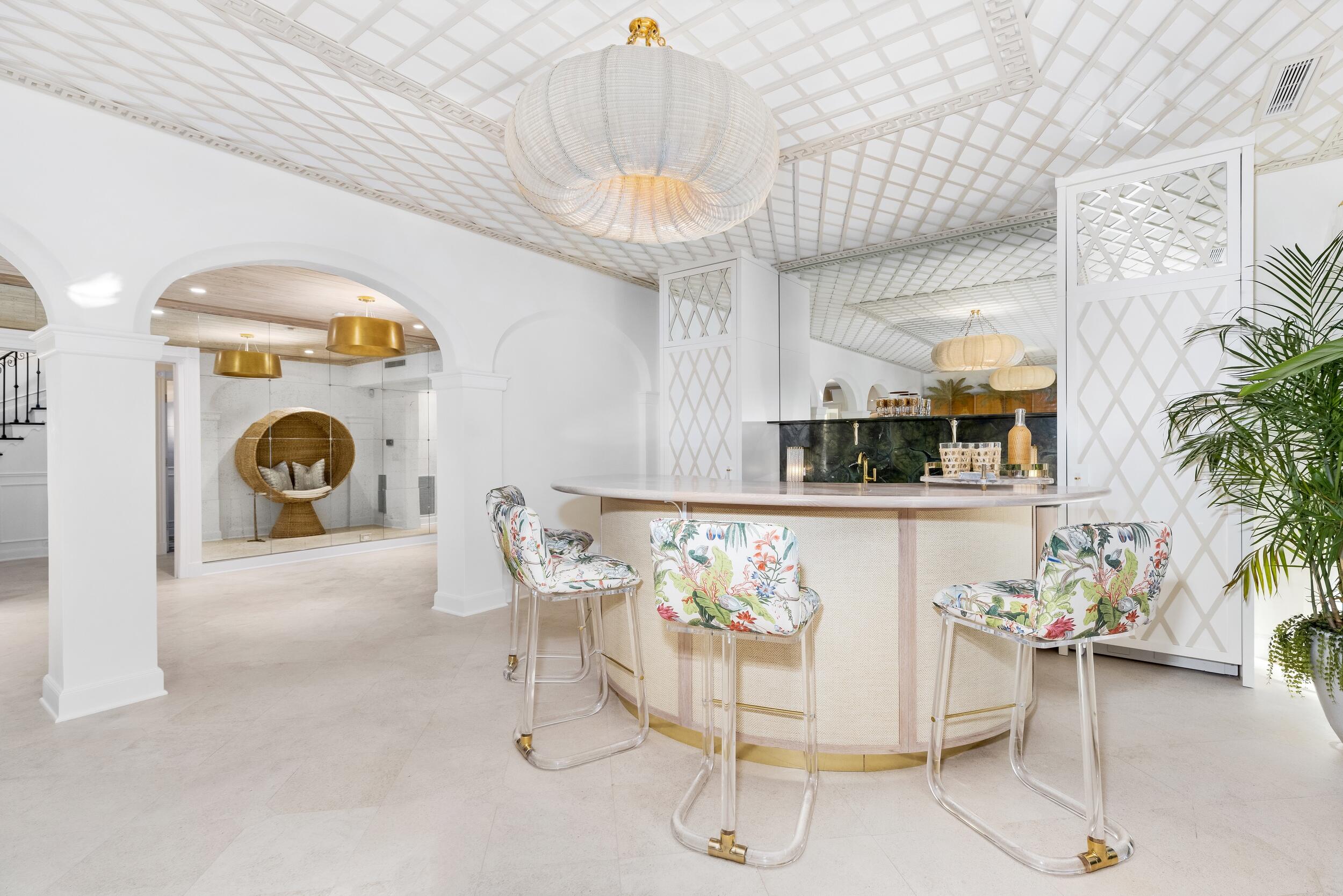 130 Cocoanut Row Palm Beach, FL 33480 - Photo 16 of 66 a view of a dining room with furniture and chandelier