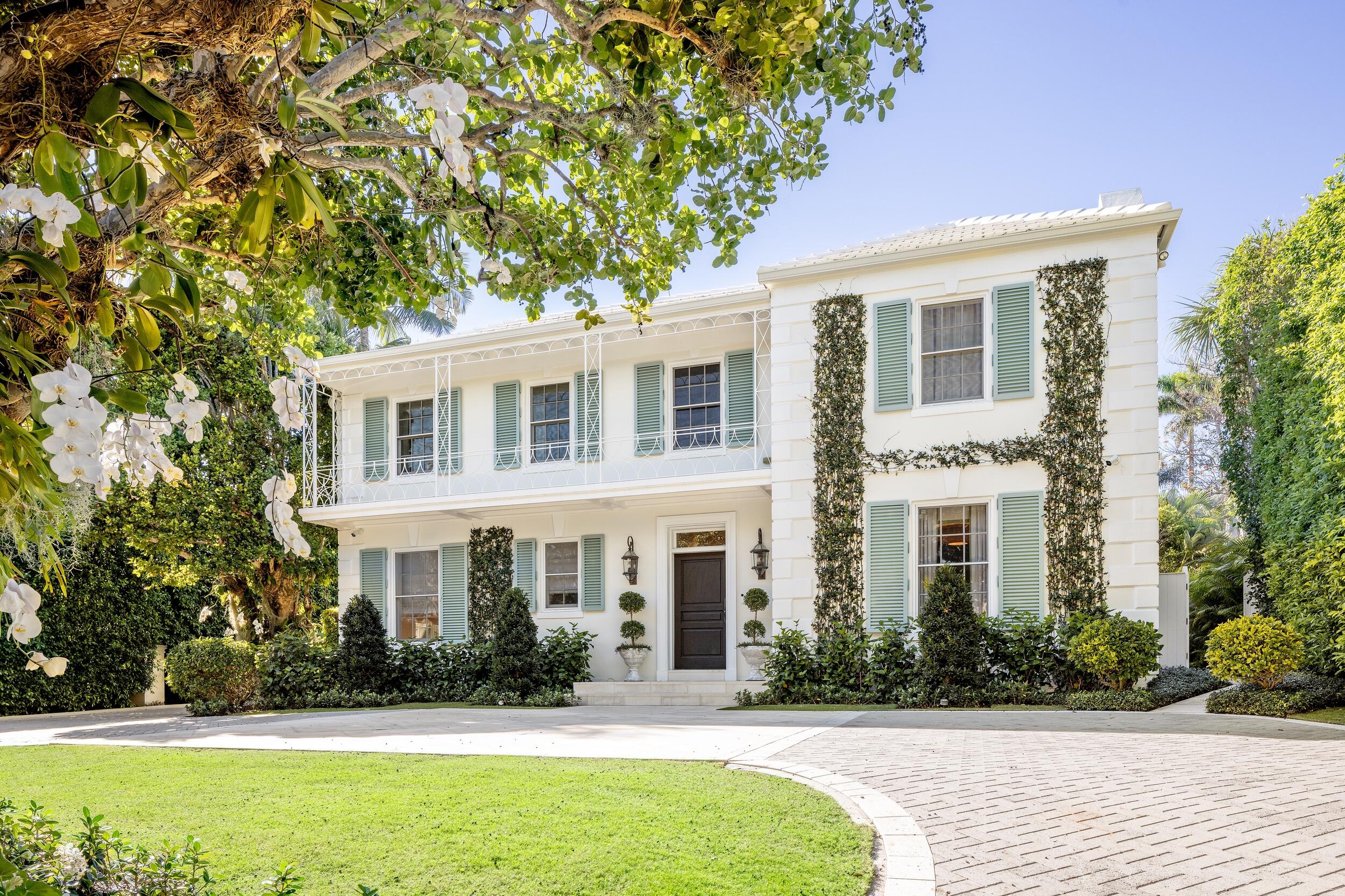 130 Cocoanut Row Palm Beach, FL 33480 - Photo 2 of 66 a front view of a house with garden