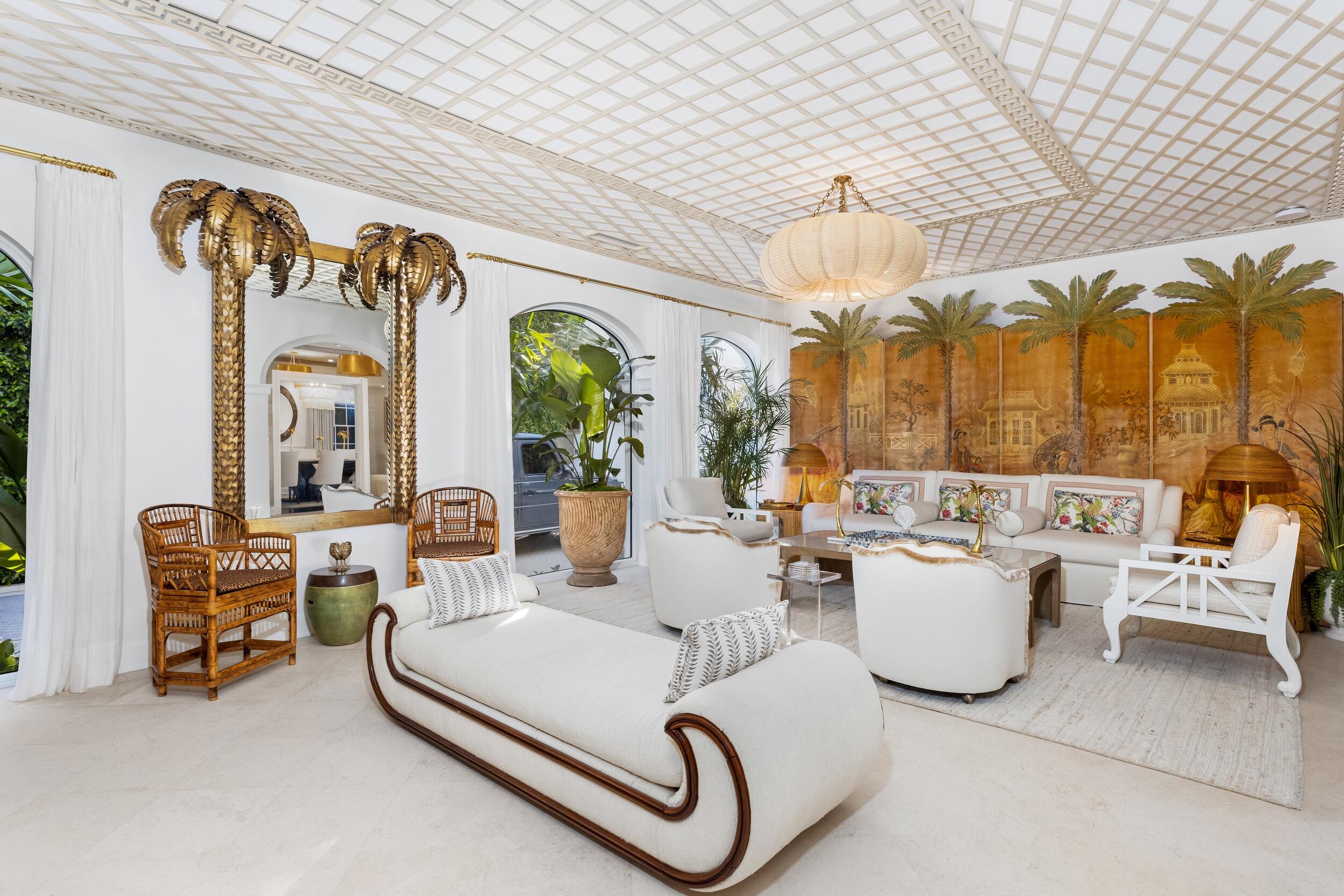 130 Cocoanut Row Palm Beach, FL 33480 - Photo 21 of 66 a living room with furniture a chandelier and a dining table