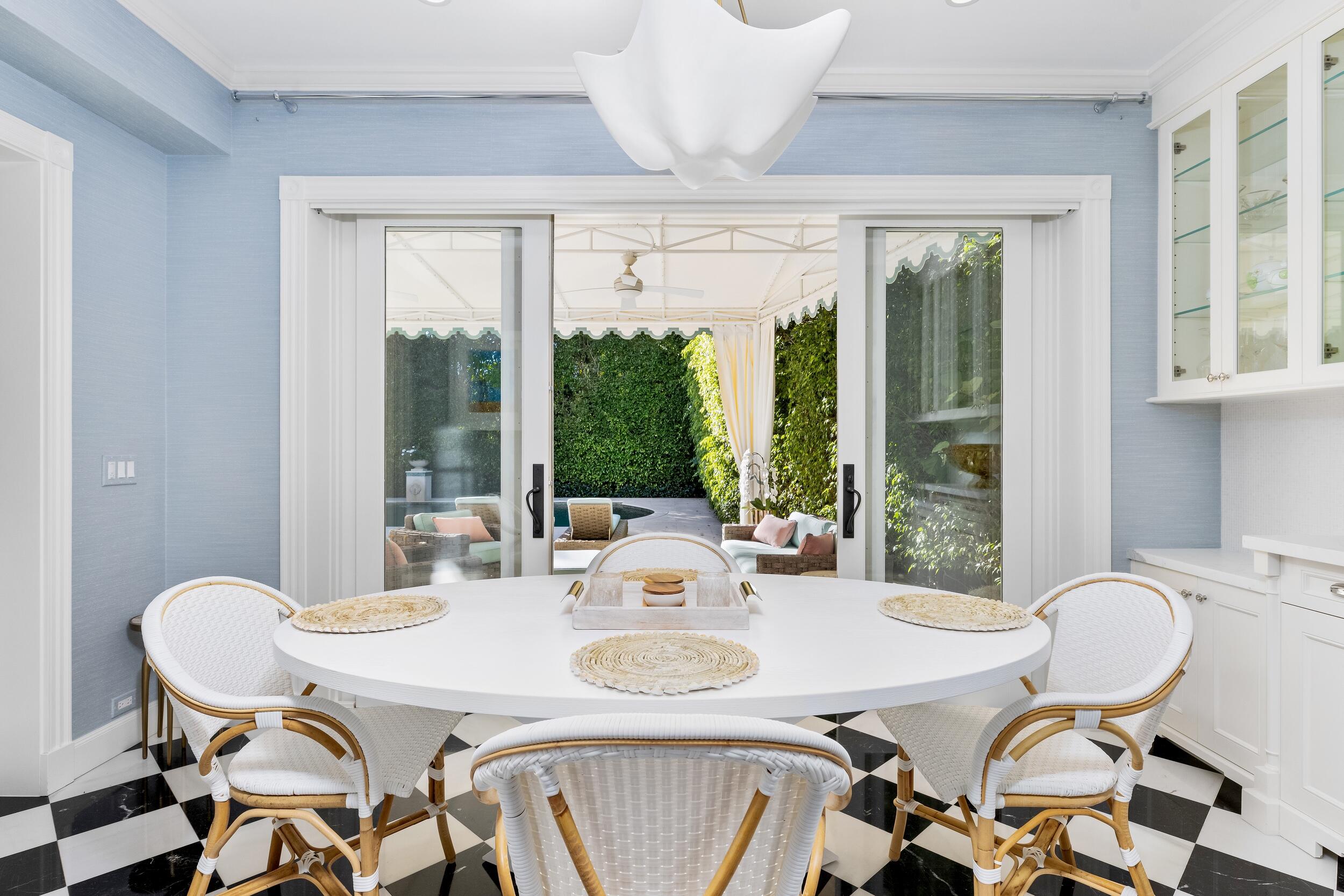 130 Cocoanut Row Palm Beach, FL 33480 - Photo 31 of 66 a view of a dining room with furniture window and outside view