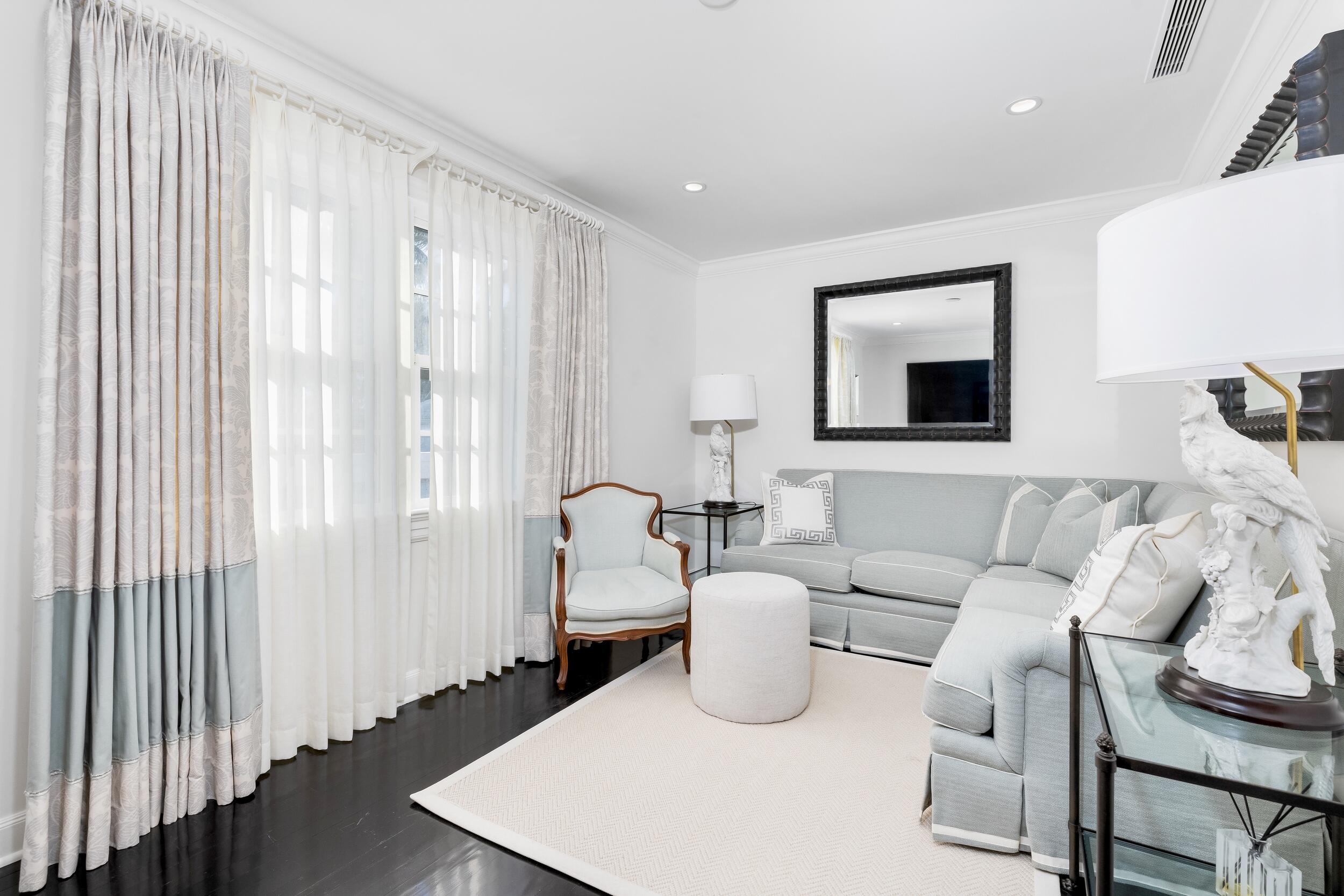 130 Cocoanut Row Palm Beach, FL 33480 - Photo 35 of 66 a living room with furniture and a window