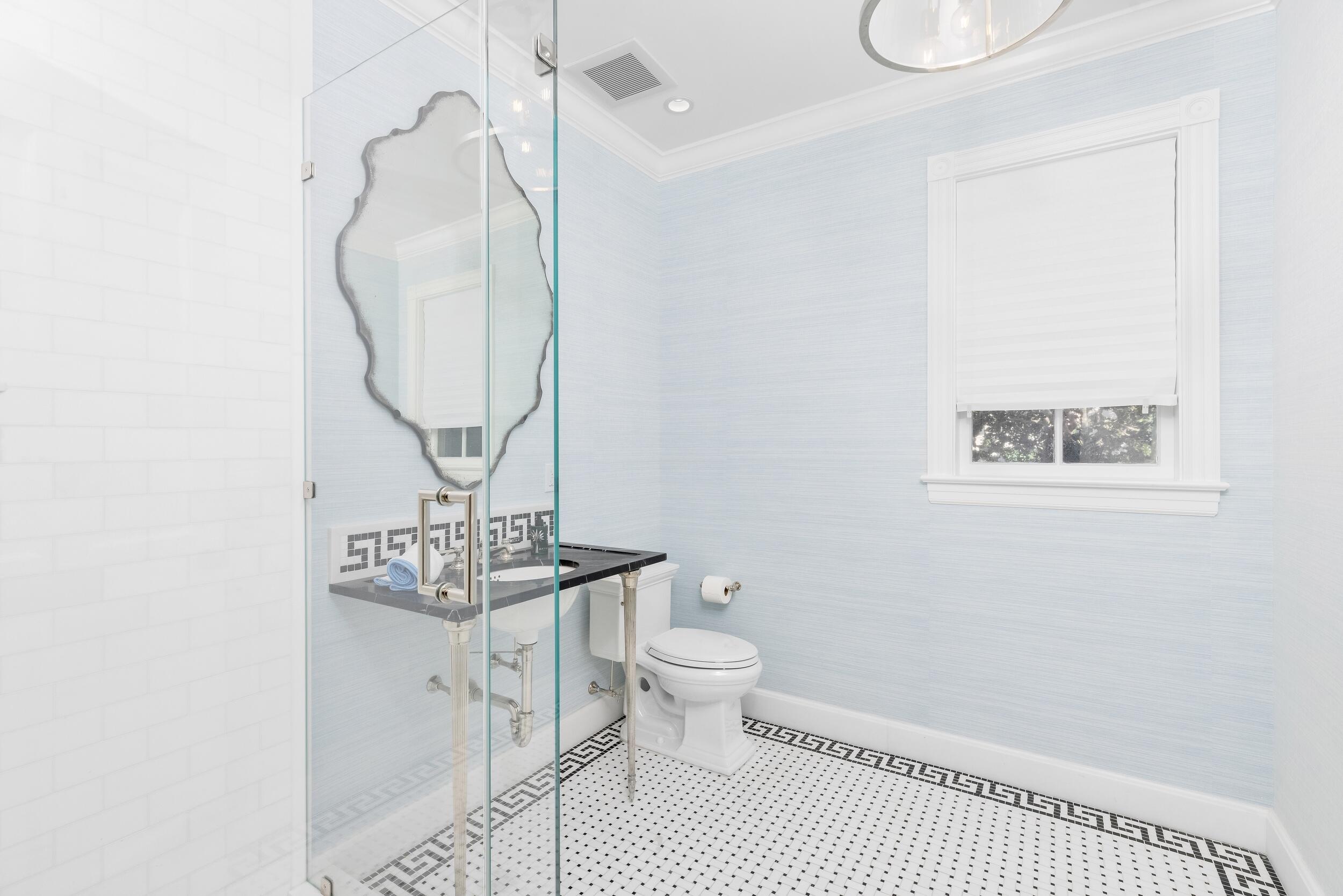 130 Cocoanut Row Palm Beach, FL 33480 - Photo 41 of 66 a bathroom with a toilet a sink and mirror