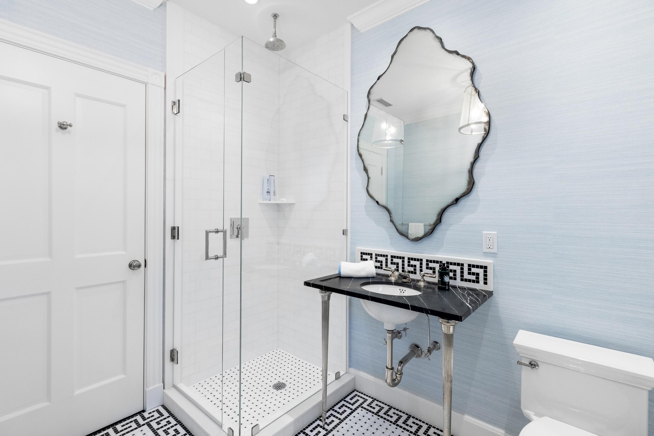 130 Cocoanut Row Palm Beach, FL 33480 - Photo 42 of 66 a bathroom with a sink a toilet and a mirror