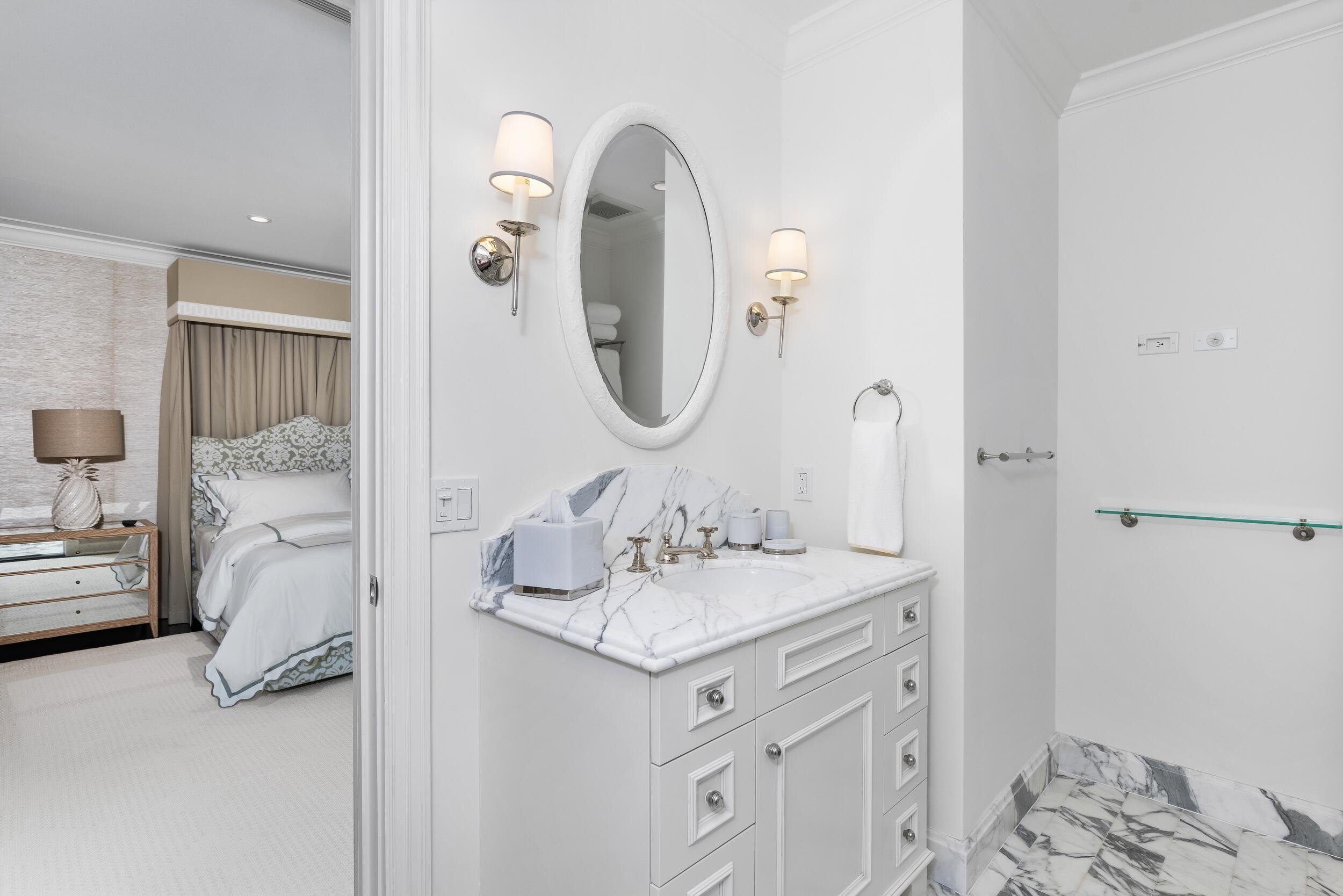 130 Cocoanut Row Palm Beach, FL 33480 - Photo 45 of 66 a bathroom with a sink and a mirror