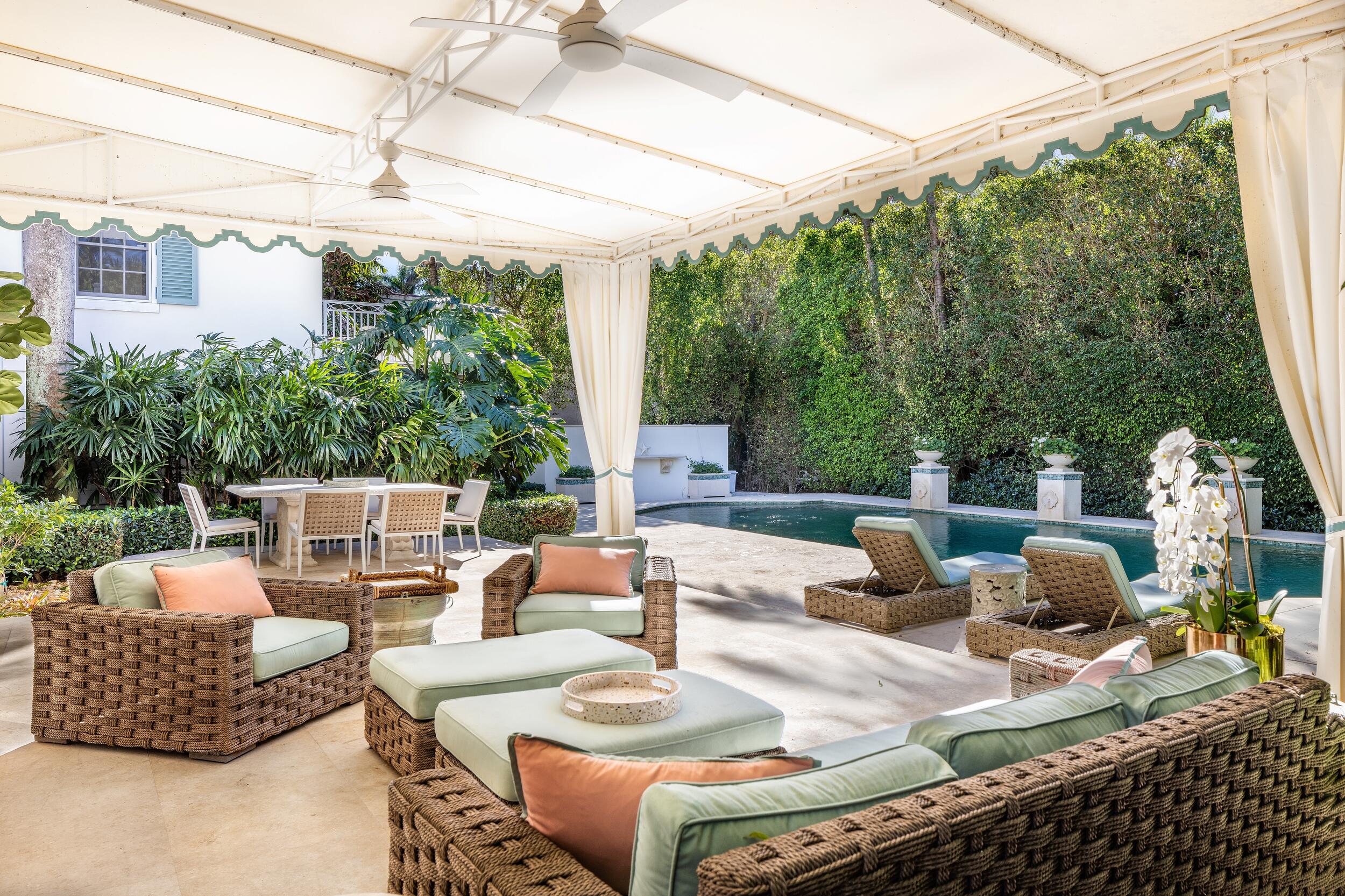 130 Cocoanut Row Palm Beach, FL 33480 - Photo 53 of 66 a view of a patio with couches table and chairs and potted plants